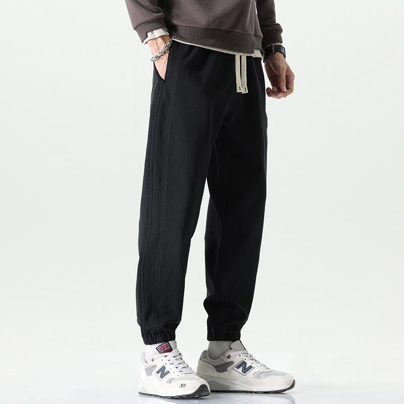 Pantalones informales de cintura elástica y ajuste holgado con corte cónico versátil y elasticidad.