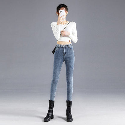 Eng anliegende, hellfarbene, hoch taillierte Jeans mit Doppelreiher und elastischer Passform für eine schlanke Silhouette