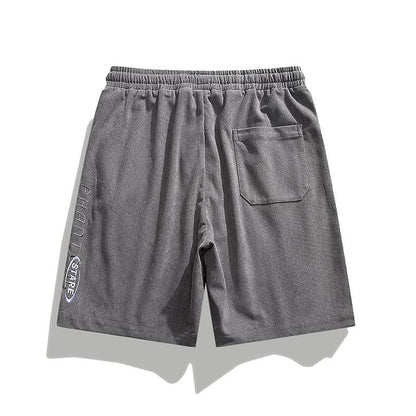 Pantalones cortos trendy de ajuste holgado con cintura con cordón de cinco puntos y sensación fresca.