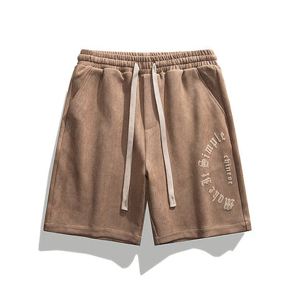 Weite Velours-Shorts in Kamelhaar-Farbe mit elastischem Bund, Kordelzug und vielseitigem Muster.