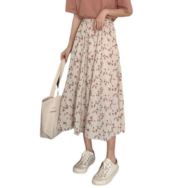 Falda de malla estampada floral de línea A fresca, sencilla, elegante y que estiliza la figura.