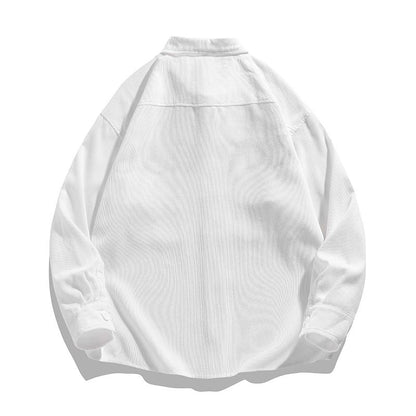Retro-Langarmhemd aus Cordstoff in Fake-Two-Piece-Optik mit Patchwork im angesagten Arbeitskleidungsstil.