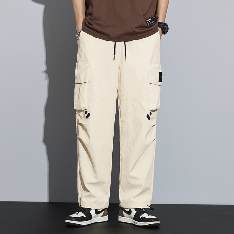Pantalon cargo polyvalent imperméable à jambes droites larges et élastiques avec poches tendance.