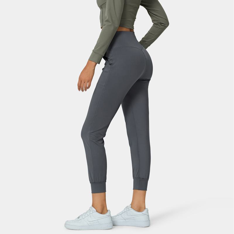 Pantalon de sport fuselé avec poches pour fitness, yoga et course à pied en extérieur.