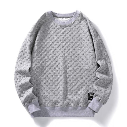 Langarm-Sweatshirt mit Rundhalsausschnitt, schlichtem Design und aufgenähten Details in einheitlicher Farbe.