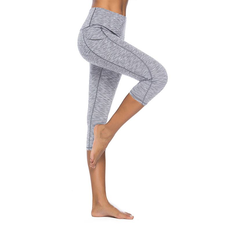 Dreiviertel-Fitness-Yoga-Sport-Leggings mit elastischer Tasche.