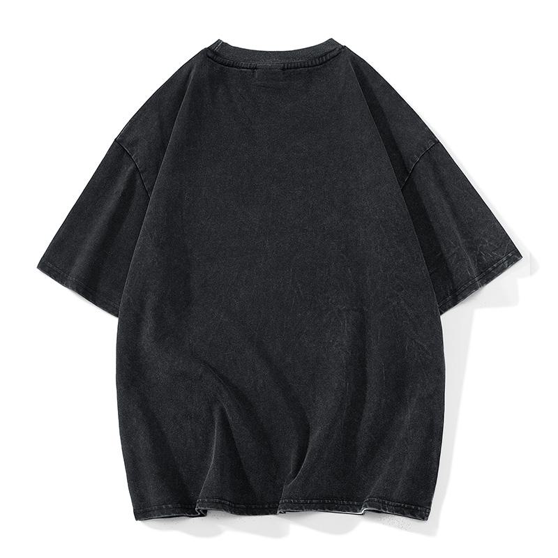 Camiseta de manga corta casual de algodón puro con caída de hombros y ajuste holgado.