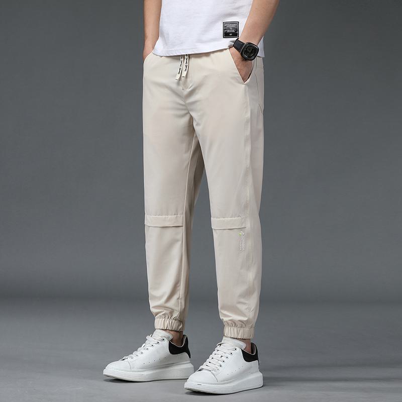 Pantalones elásticos de moda y sueltos con corte recto y ajuste cónico