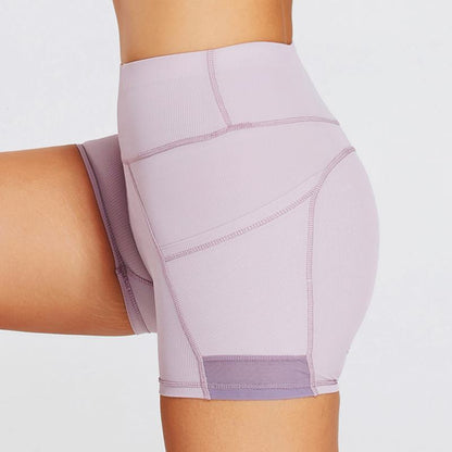 Pantalones cortos deportivos ajustados de yoga de cintura alta con bolsillo ultra cortos y acanalados para fitness.