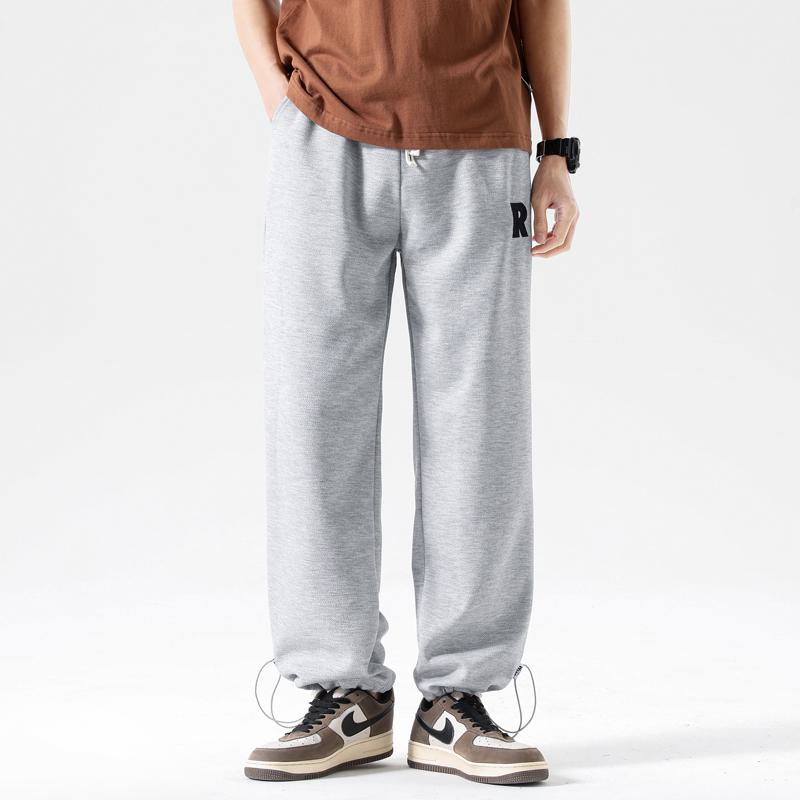 Pantalon de sport décontracté en tricot à la cheville, tendance et polyvalent, avec cordon de serrage.