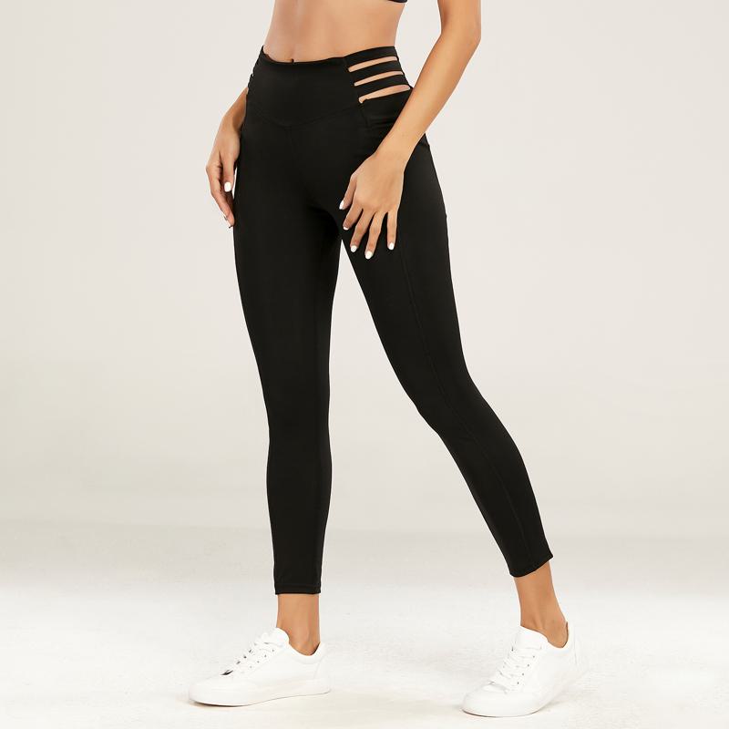 Leggings deportivos ajustados de yoga de secado rápido de cintura alta con diseño de huecos para fitness