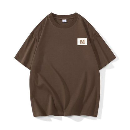 Cómoda, moderna y versátil camiseta de manga corta de algodón puro con cuello redondo y estampado.