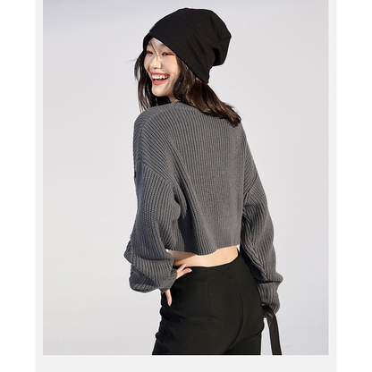 Pull ample en tricot décontracté, à taille basse et manches courtes.
