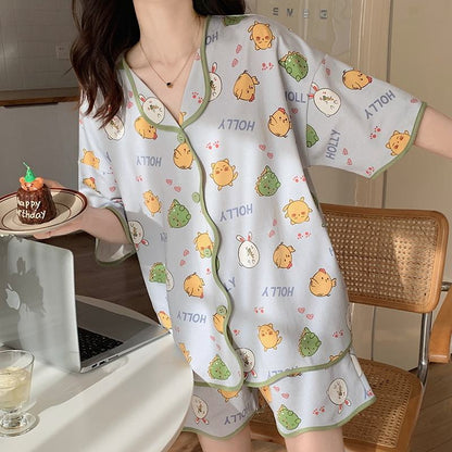 Conjunto de pijama lindo con botones y dibujos animados