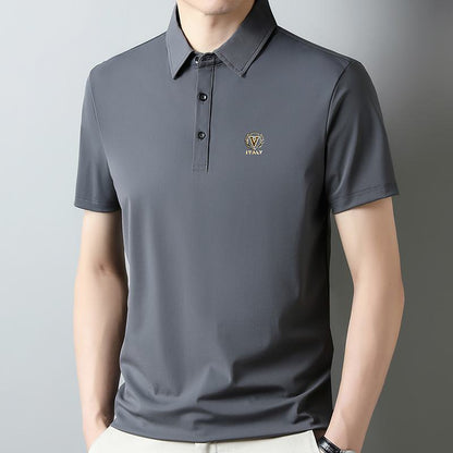 Kurzärmeliges Polo-Shirt aus seidiger, knitterresistenter Tencel mit Hahnentritt-Muster und Reverskragen.