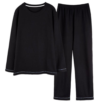 Eng gewebtes Pullover-Set aus reiner Baumwolle mit Rundhalsausschnitt, in einheitlicher schwarzer Hahnentrittmusterung, langen Ärmeln.
