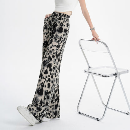 Pantalon large à imprimé léopard en mousseline de soie à la teinture attachée et à l'effet drapé
