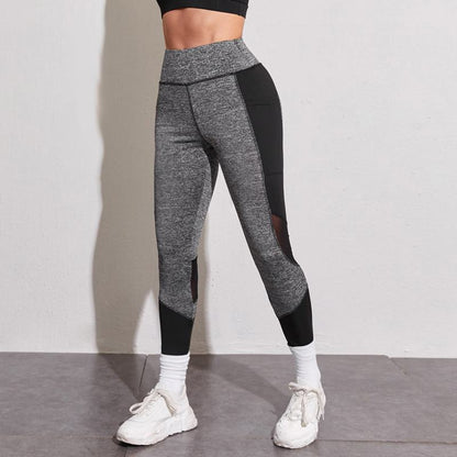 Leggings deportivos ajustados con bolsillo para entrenamiento de yoga y running con malla de parches.