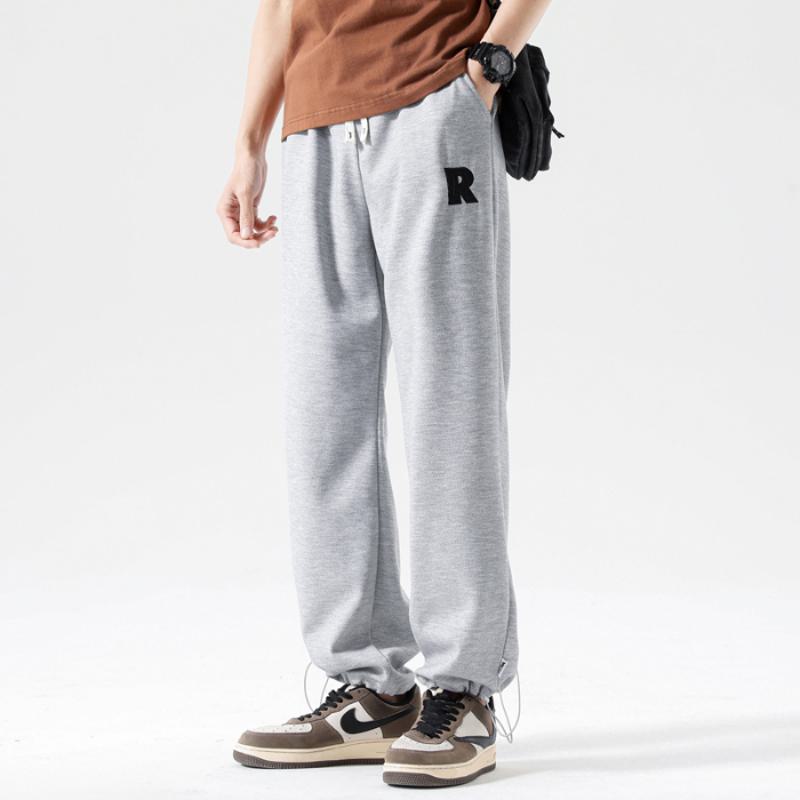 Pantalón de deporte casual de punto versátil y moderno con tobillo suelto y cordón ajustable.