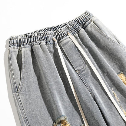 Trendige, weite und verwaschene Straight-Fit-Jeans mit elastischem Bund.