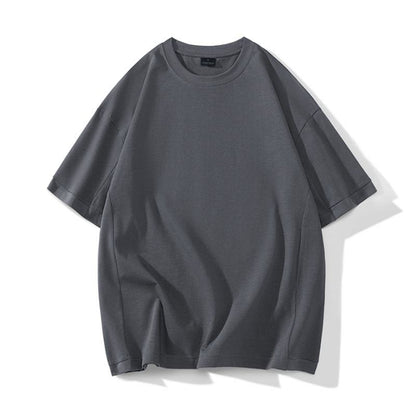 T-shirt à manches courtes en coton pur lavé, couleur unie et coupe ample, style rétro.