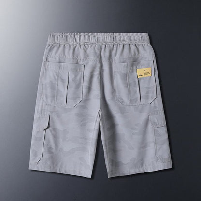Shorts décontractés minces à taille à cordon, poches à rabat, et motif camouflage tendance au travail.