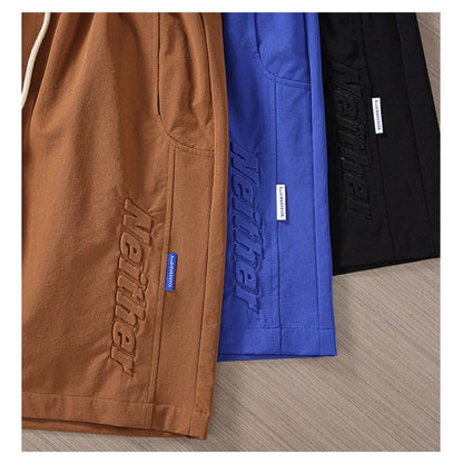 Pantalones cortos de cintura ajustable con bolsillos inclinados y cordón