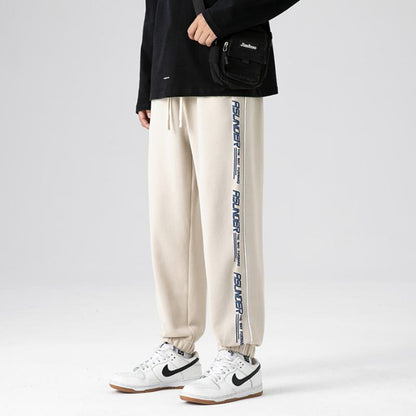 Pantalón deportivo de punto estampado a la moda, ajustado y holgado con cordón