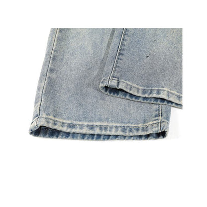 Jeans rectos retro de ajuste holgado, con aspecto desgastado y salpicaduras de tinta casual.