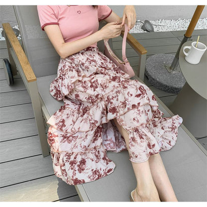 Falda midi de encaje en capas versátil con estampado floral y parches en la cintura alta.