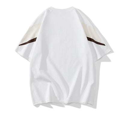 トレンディでカジュアルなラウンドネックの純綿ルーズフィット半袖Tシャツ。