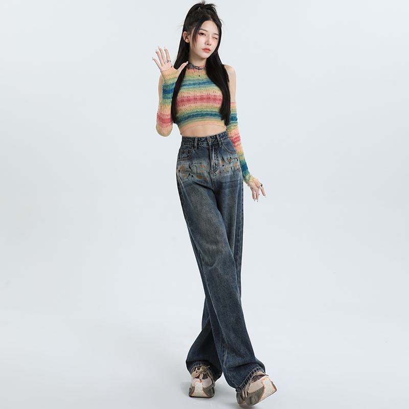 Weite High-Waist-Jeans mit Graffiti-Muster für eine schlanke Silhouette.