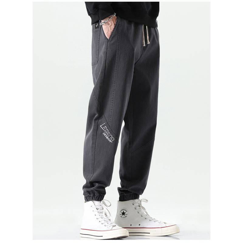 Pantalones sueltos casuales con cintura elástica y deportiva con ajuste cónico y elasticidad versátil.