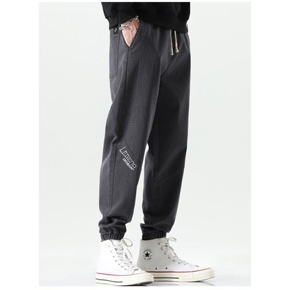 Pantalones sueltos casuales con cintura elástica y deportiva con ajuste cónico y elasticidad versátil.