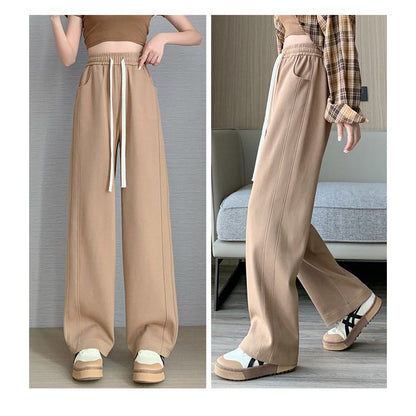 Pantalon ample de sport à la mode de style rue, longueur jusqu'au sol, en forme de banane.