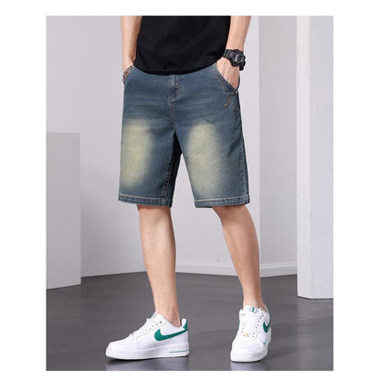 سروال جينز قصير بخصر مطاطي وتصميم عتيق برباط فضفاض.