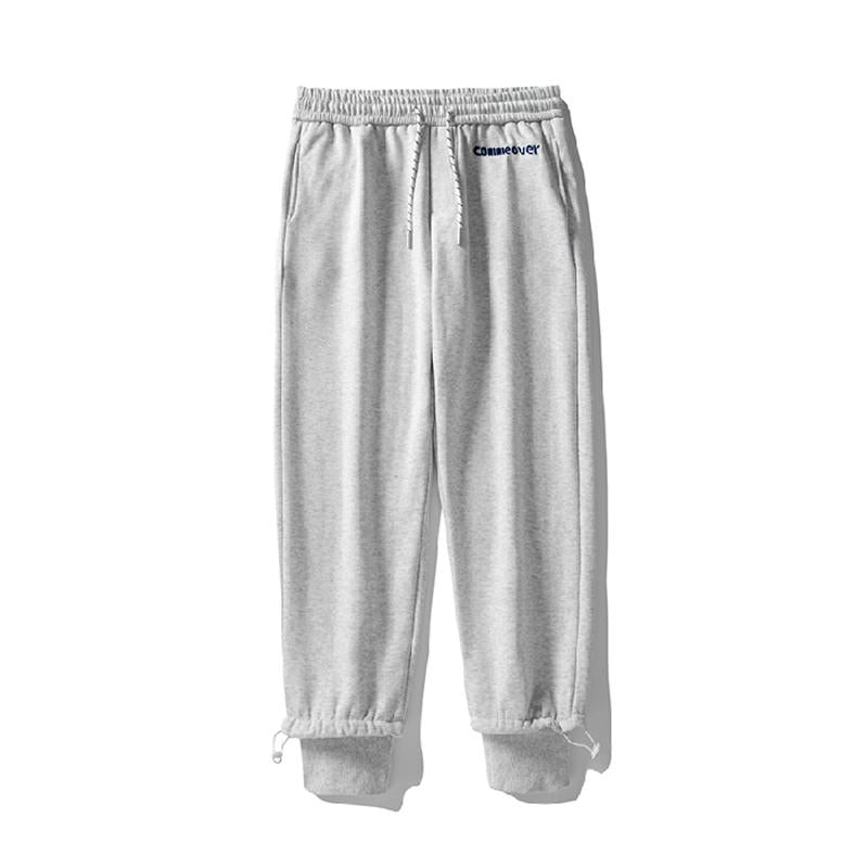 Pantalon de survêtement ample en coton pur avec taille élastique et coupe fuselée, broderie