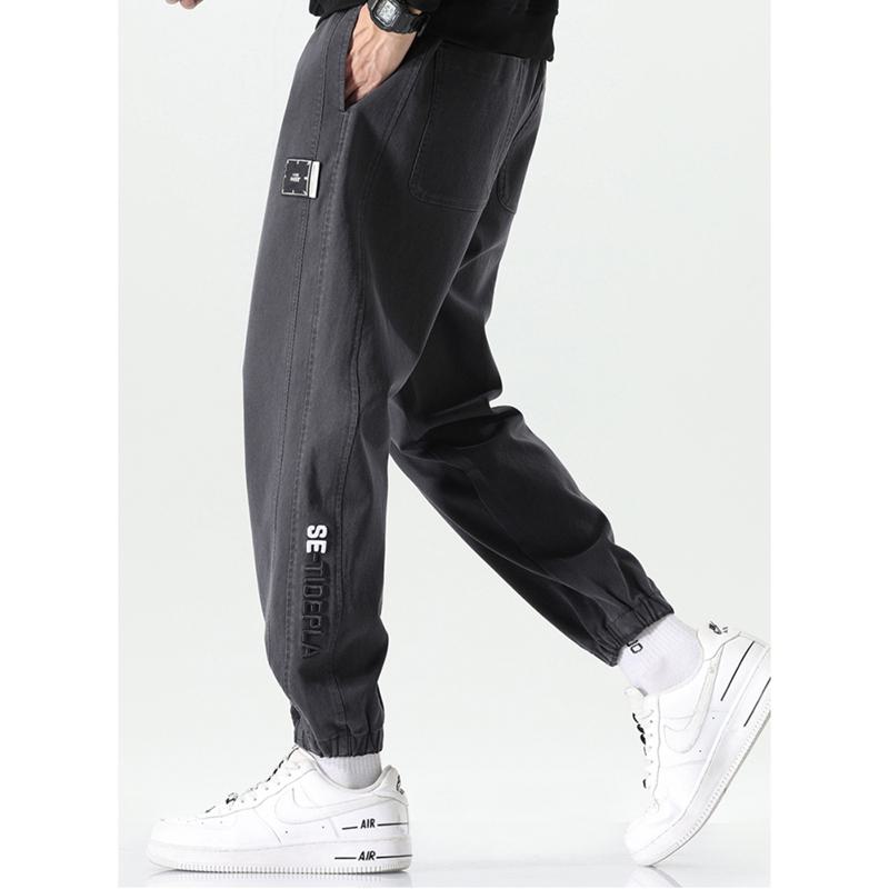 Pantalones informales de cintura elástica y ajuste holgado con corte cónico versátil y elasticidad.