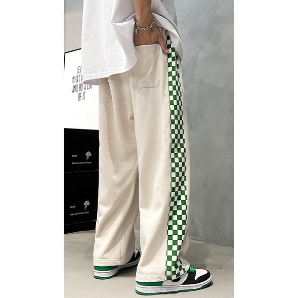 Pantalón de chándal de estilo callejero tejido deportivo de corte entallado y suelto.