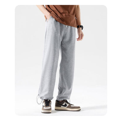 Pantalon de sport décontracté en tricot à la cheville, tendance et polyvalent, avec cordon de serrage.