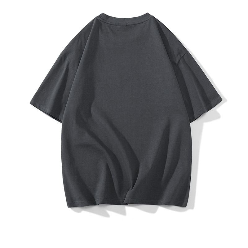 Tee-shirt à manches courtes ample, confortable et tendance en coton pur avec détails patchés et épaules tombantes.