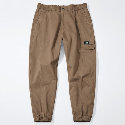 Pantalones amplios de algodón puro con corte cónico versátiles y elásticos