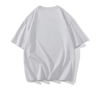 T-shirt à manches courtes ample et confortable en coton pur avec motif de lettres.