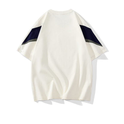 トレンディでカジュアルなラウンドネックの純綿ルーズフィット半袖Tシャツ。