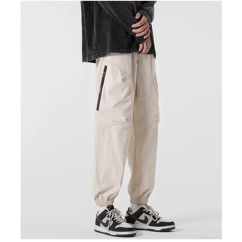 Lässige, schmale, vielseitige, elastische Reißverschluss-Hosen mit Taschen.