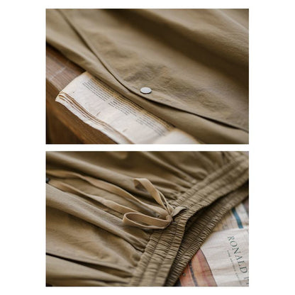 Pantalon en coton pur avec taille élastique effilée, coupe ample en forme de lanterne et cordon de serrage