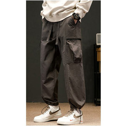 Pantalones de carga cónicos de ajuste holgado con cordón elástico
